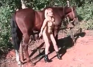 Skinny blonde fucks with a stallion