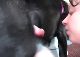 Brunette is blowing a nice dog dick