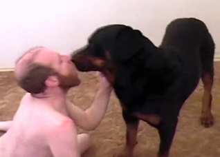 Black dog fucks a horny old man