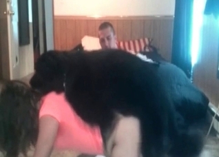 Doberman holds her tight waist and fucks